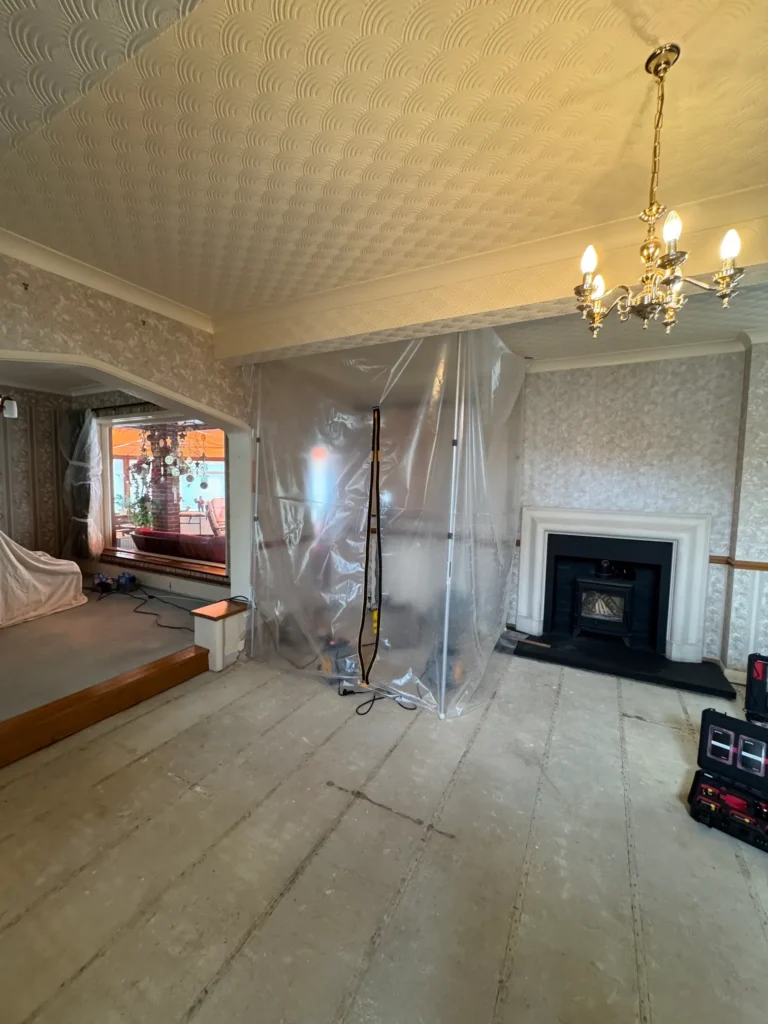 A lounge is fully enclosed in protective plastic as Rajvar prepares for restoration.