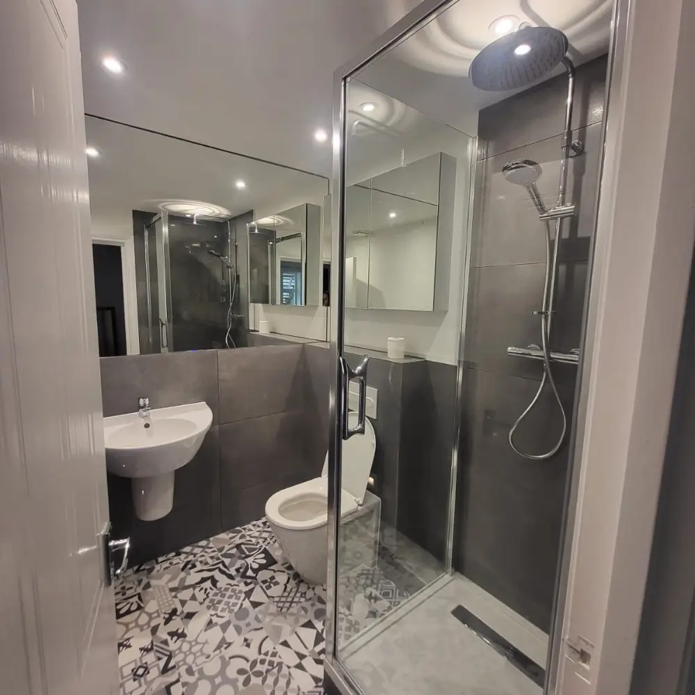 A recently completed bathroom shows the result of Rajvar’s restoration work.